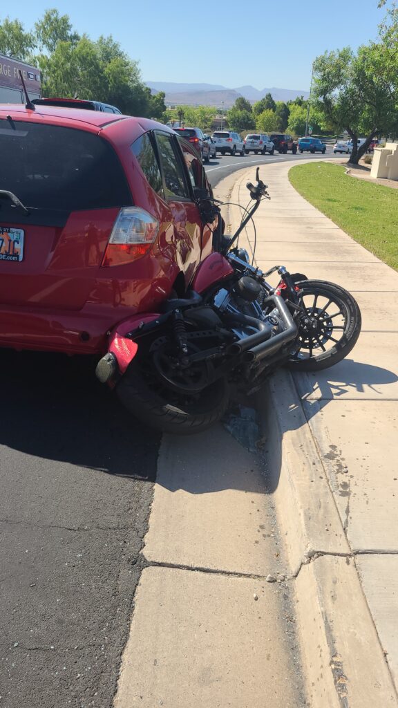 car crash involving a can and a motorcycle
