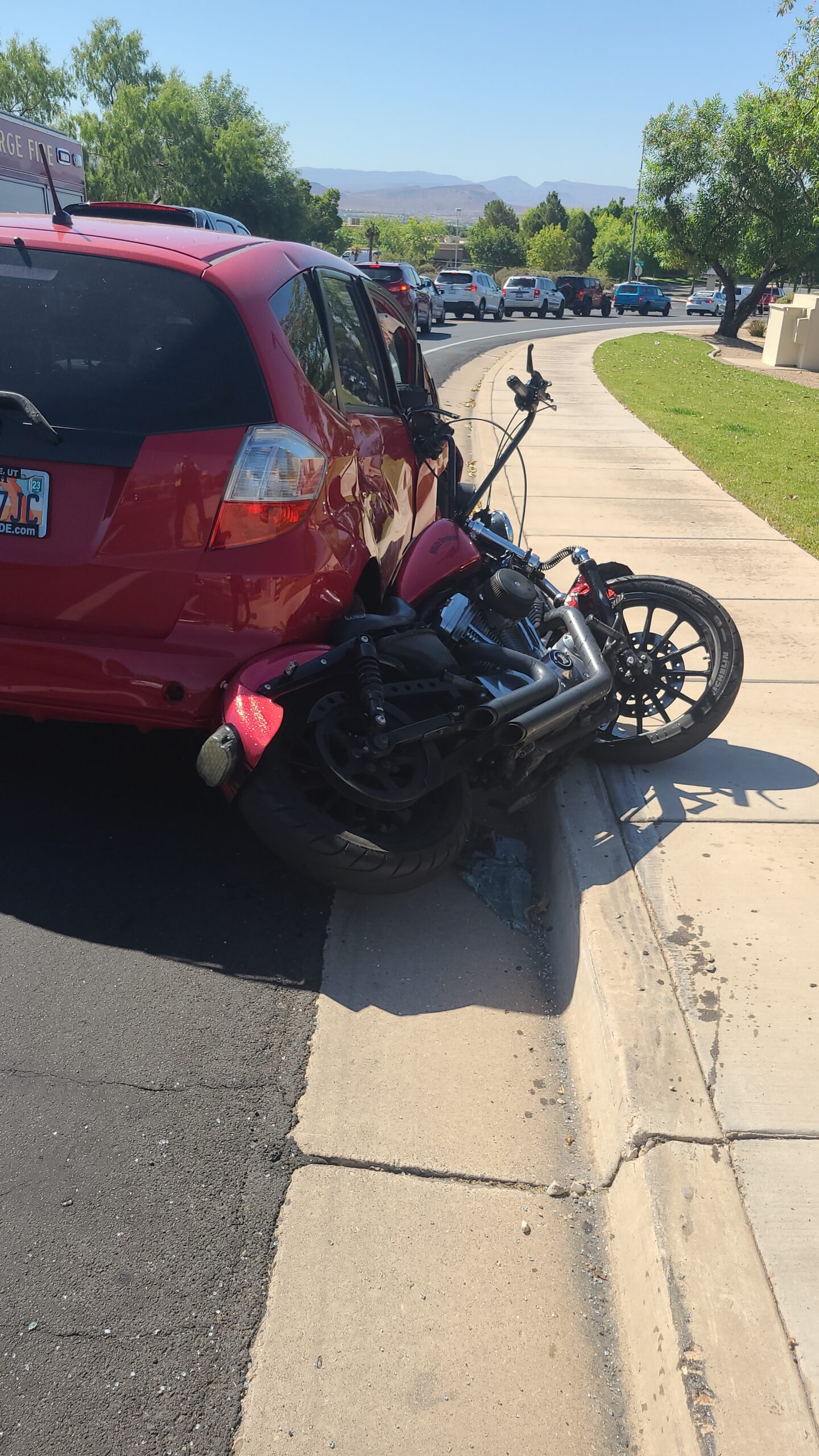 car crash involving a can and a motorcycle